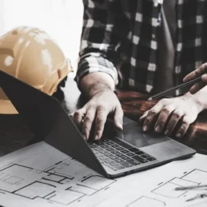 contractor getting a certified payroll report on his computer